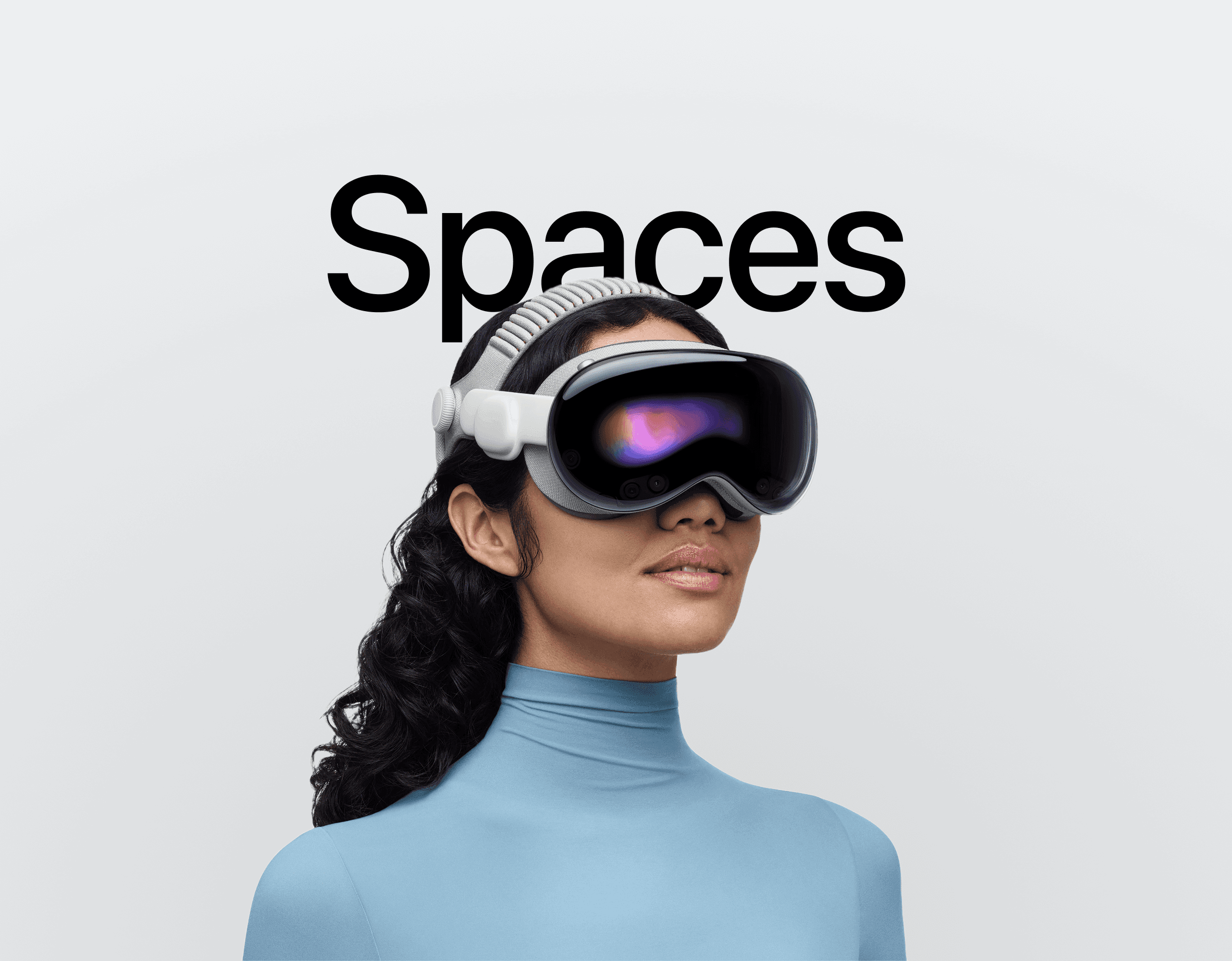 Women wearing Vision pro and "Spaces" text behind her 