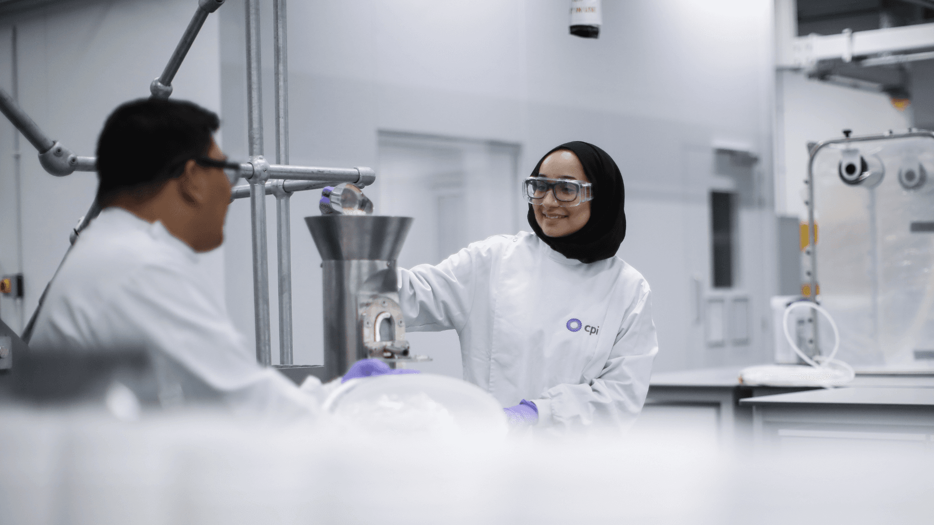 Two CPI experts mixing chemicals.