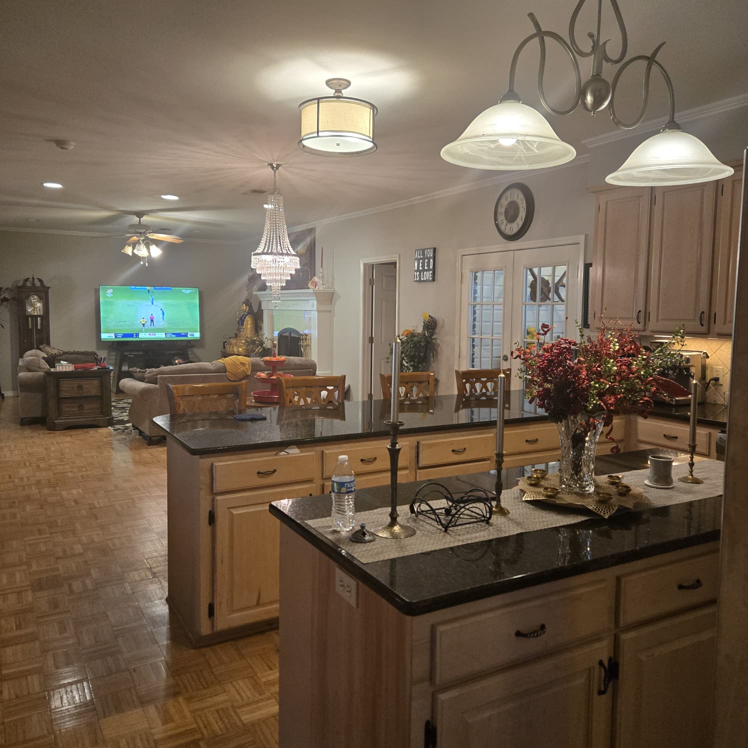 white wooden kitchen cabinet with black pendant lamp