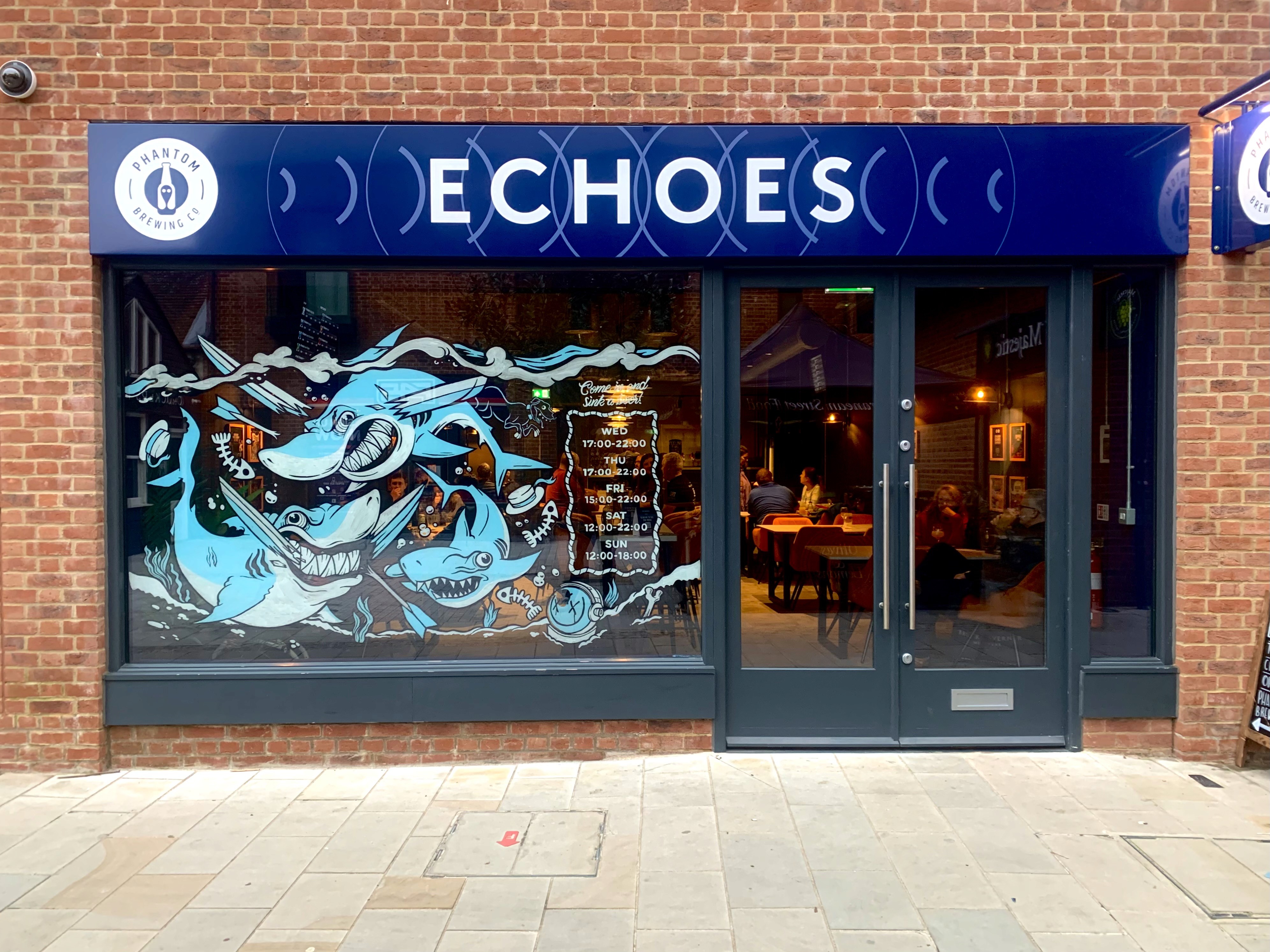 photo of a shop window with the shop name 'echoes' and an illustration on the window