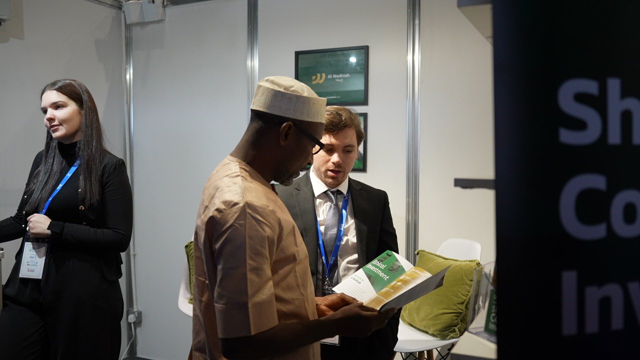 person writing on a piece of paper