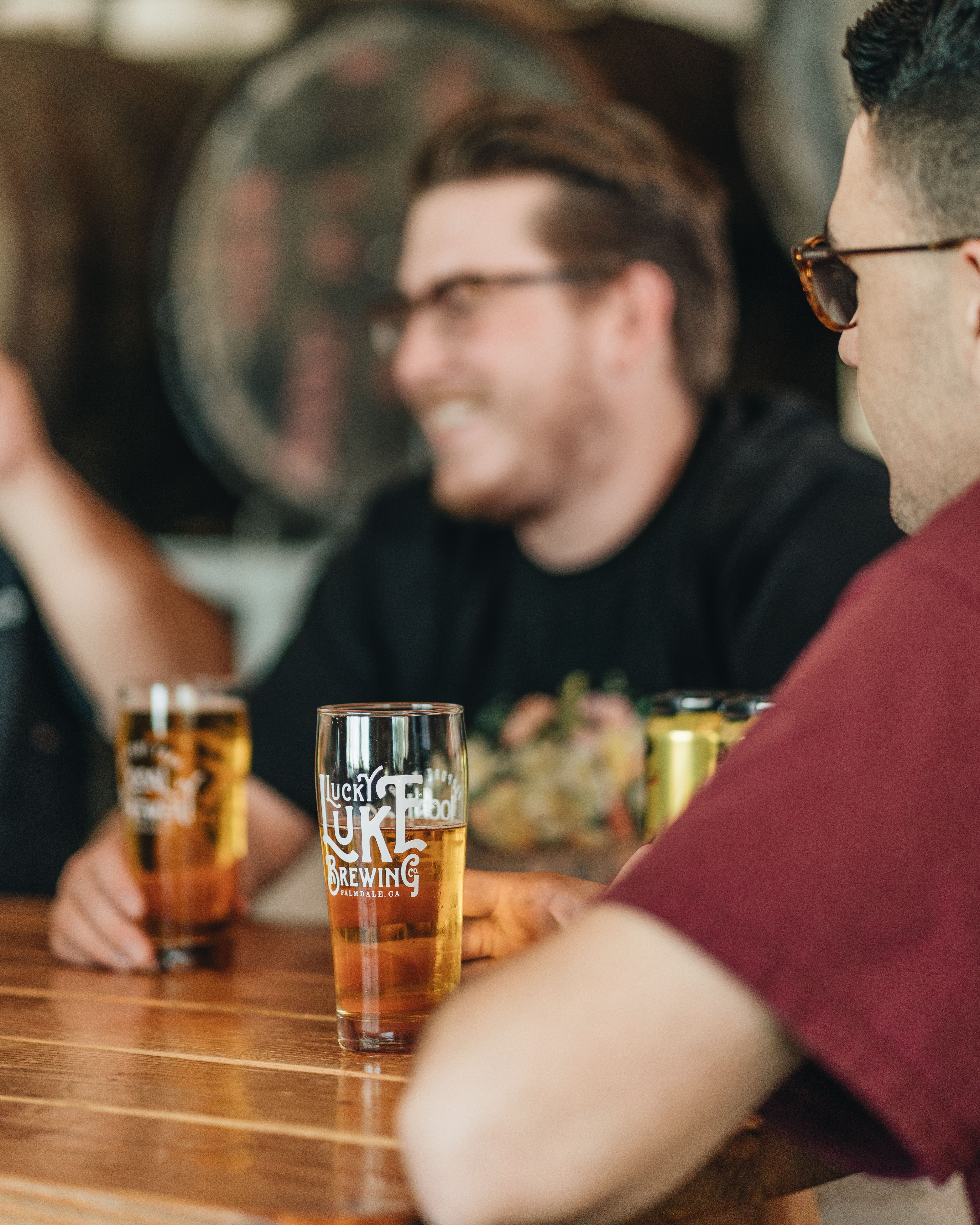 Group enjoying Lucky Luke beer flight at brewery