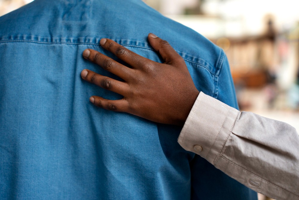 Hand consoling someone. Mandt system