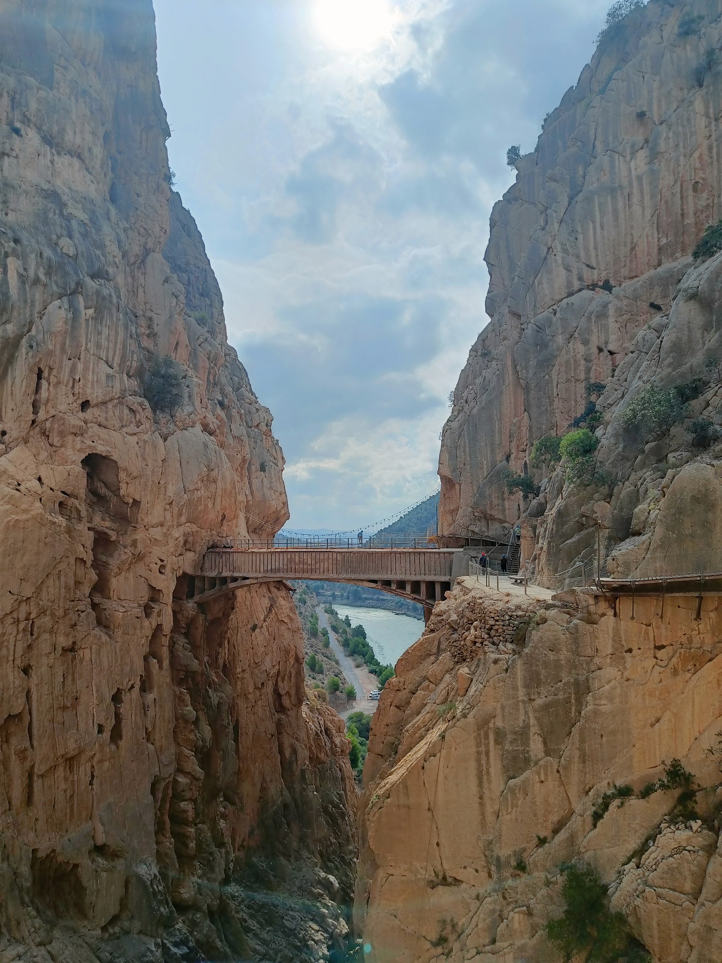 Rocky canyon with a bridge between steep cliffs.