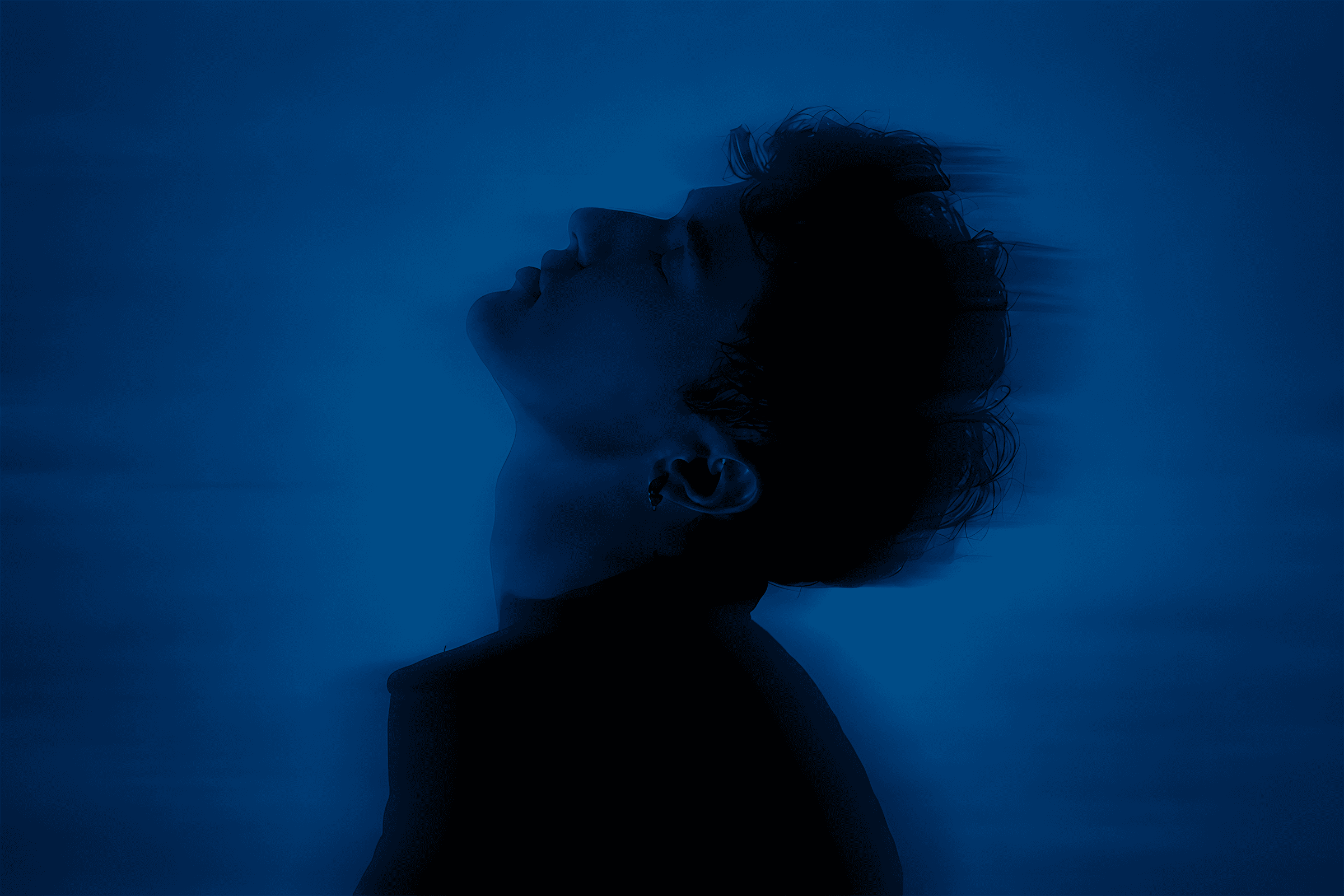 Man looking upward with motion blur effect representing growth and momentum