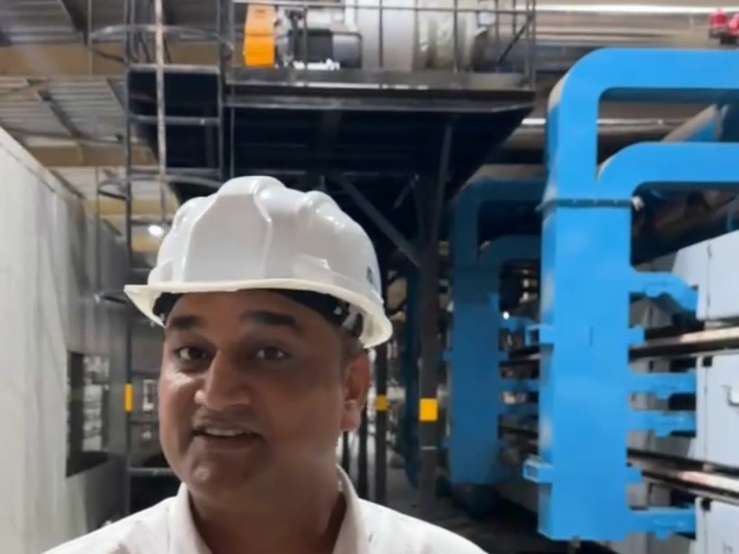 Anil Kohli, Production Head at J4S, on the plant floor in front of the glass processing line
