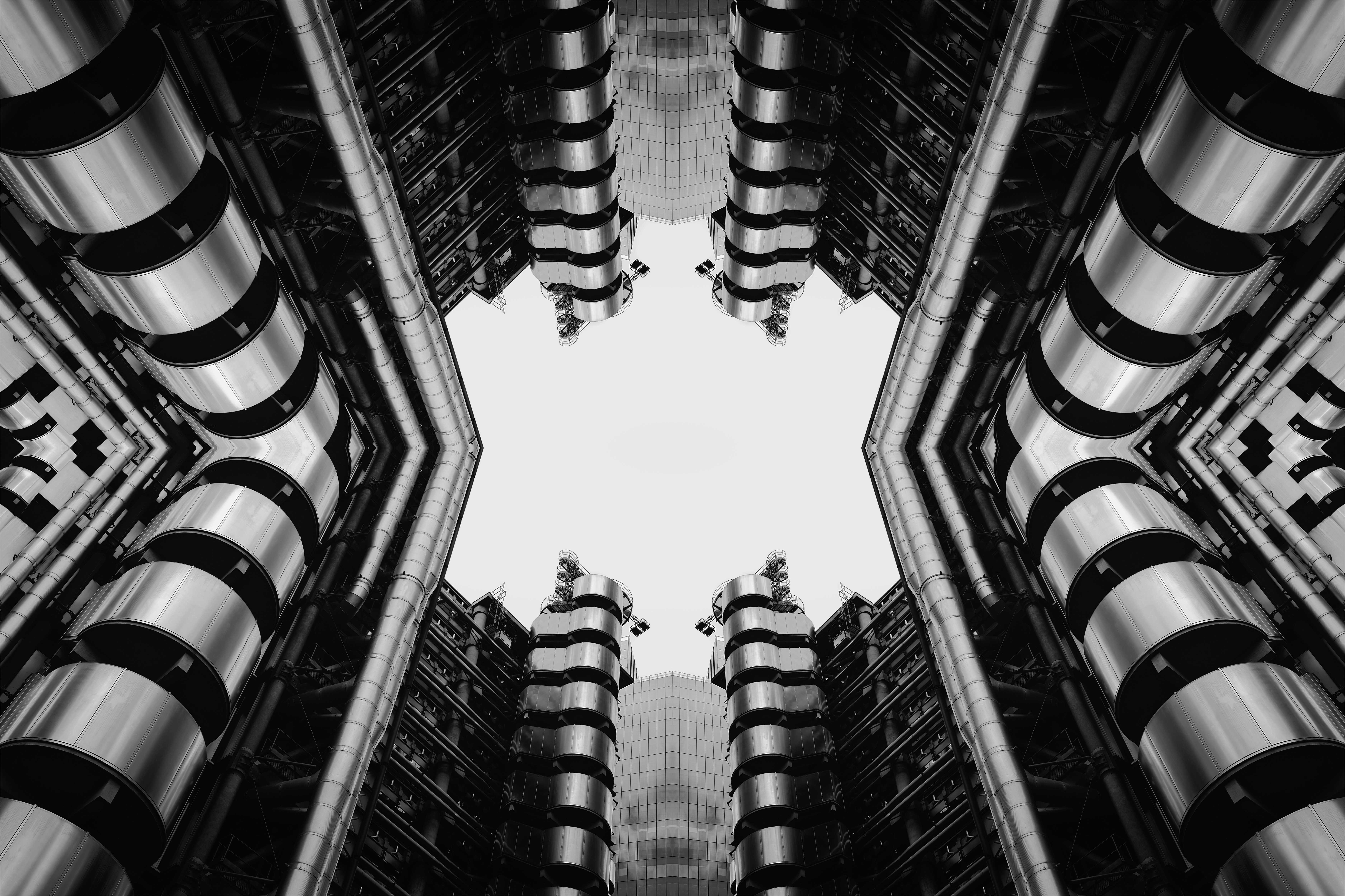 Symmetrical view of modern buildings against a bright sky