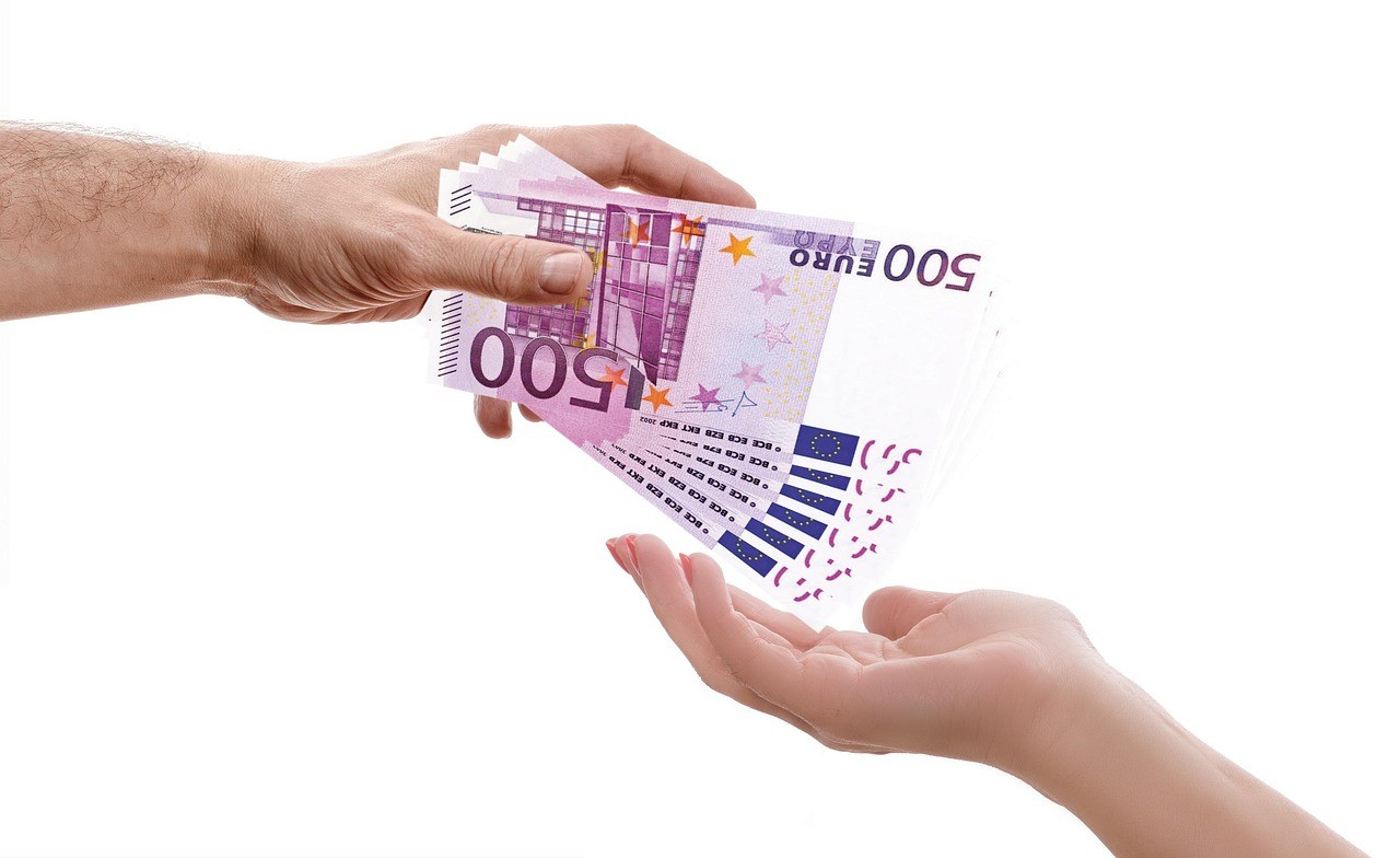 Bundles of 500 Euro notes representing money transfer