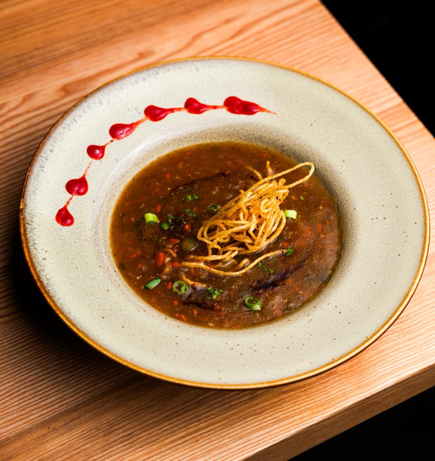 Hot and spicy manchow soup at Dhoom Greektown Toronto, Indo-Chinese soup topped with crispy noodles