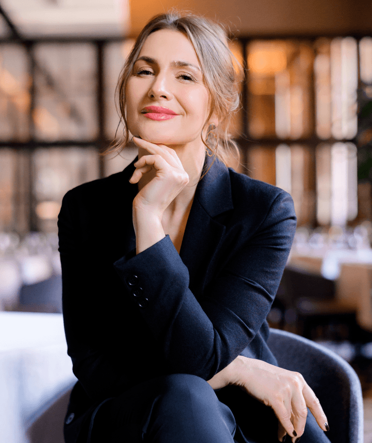 a group of children sitting on steps in front of a building