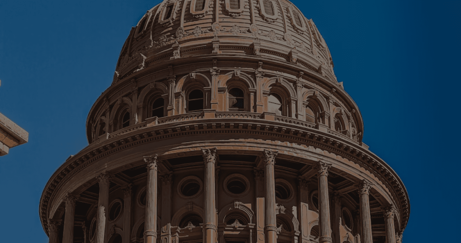 image of a state house building against a blue sky