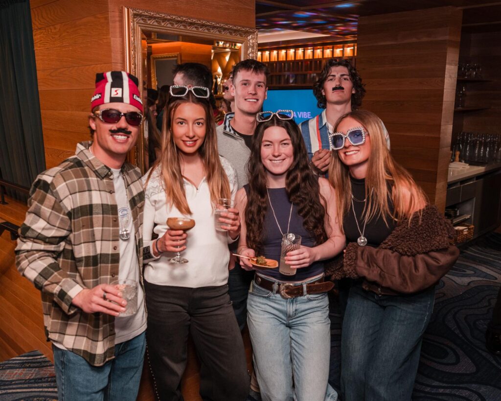 Group of guests posing together in playful costumes