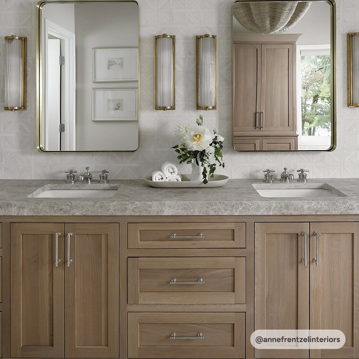 taj mahal quartzite bathroom countertop with natural oak cabinets