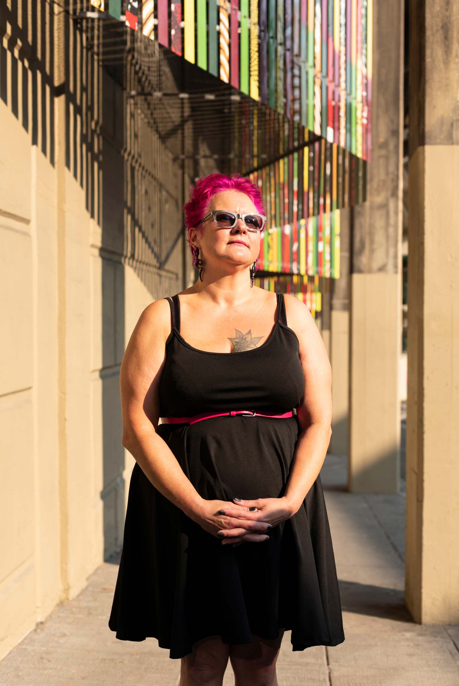 Amy standing in front of a wall.