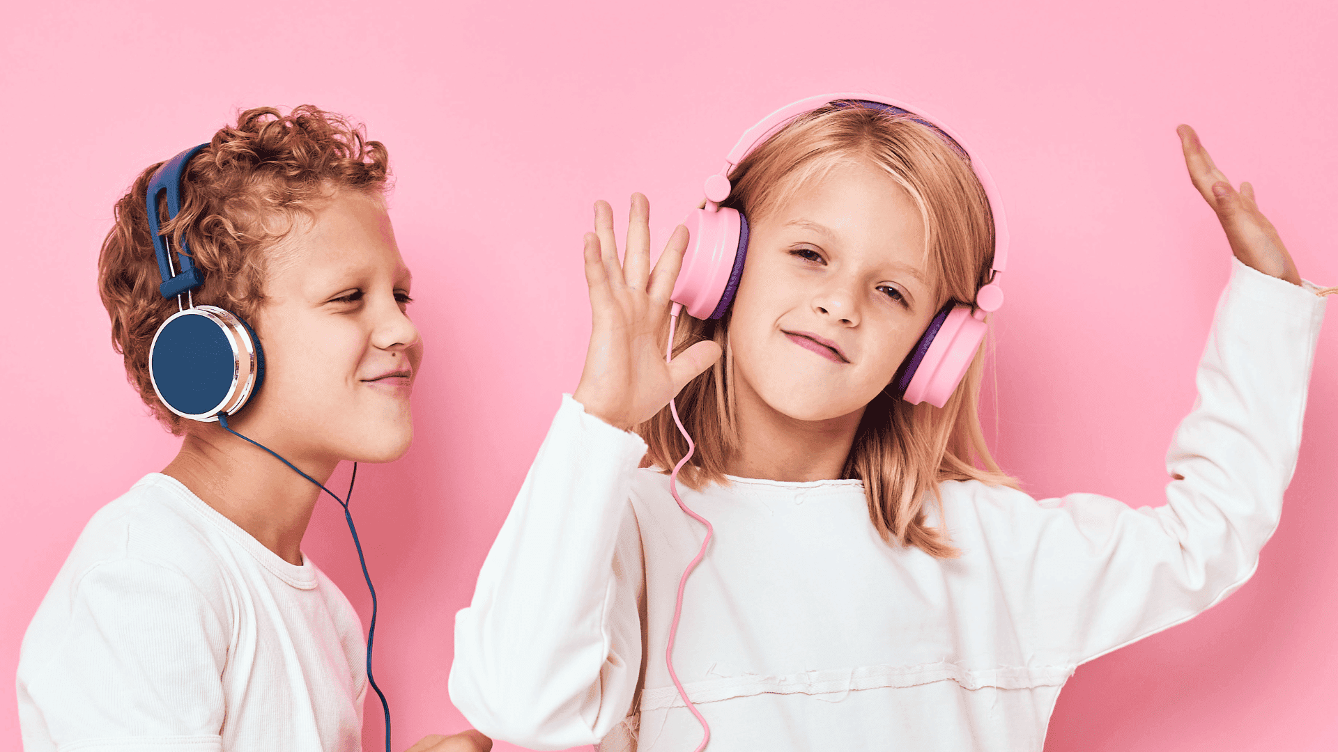 A girl wearing headphones, smiling at the camera while listening to HushAway®’s Sound Sanctuary.