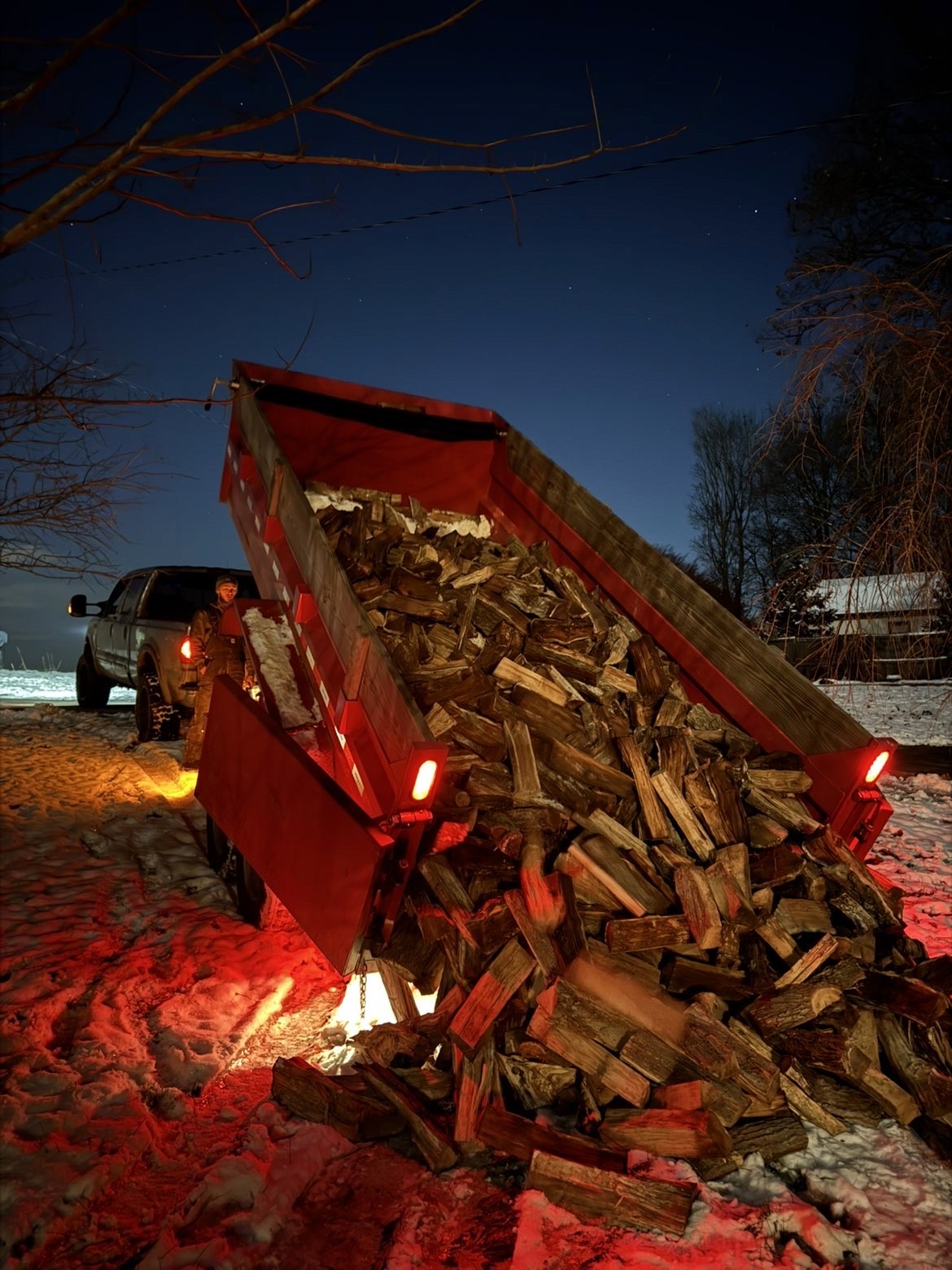 Dump trailer dumping wood