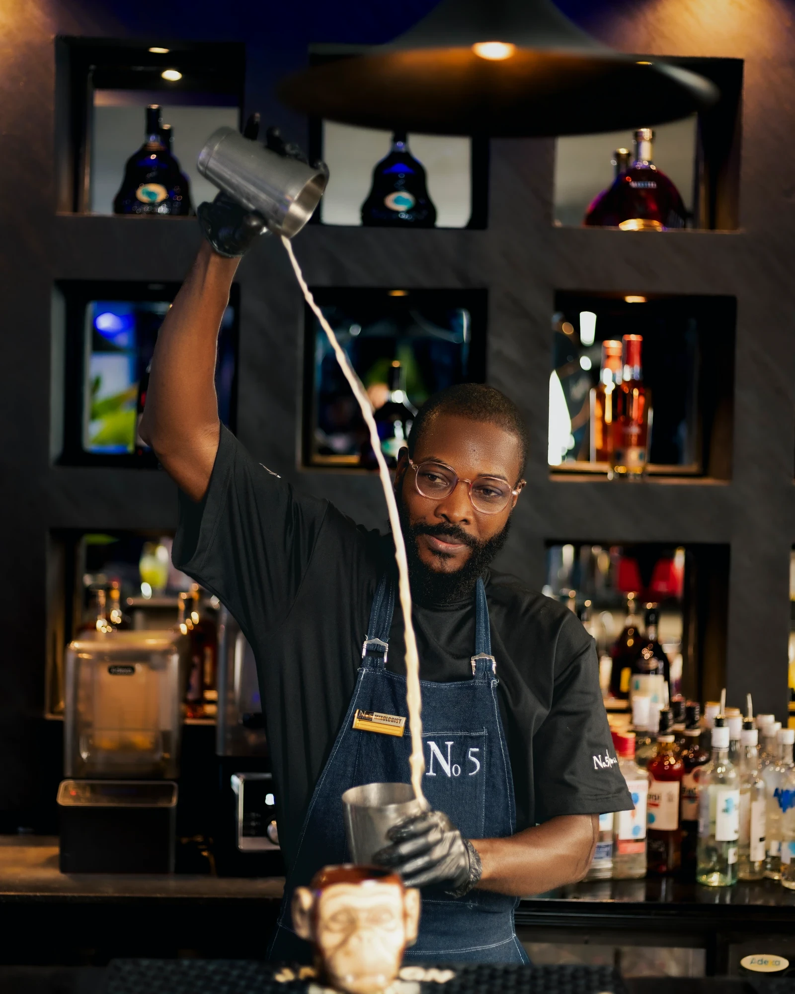 N0.5 Bartender exclusively mixing cocktail