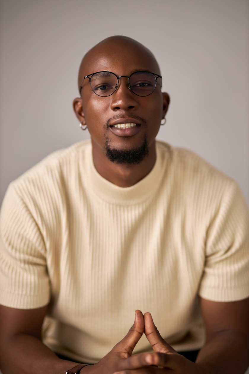 Smiling agency founder wearing glasses