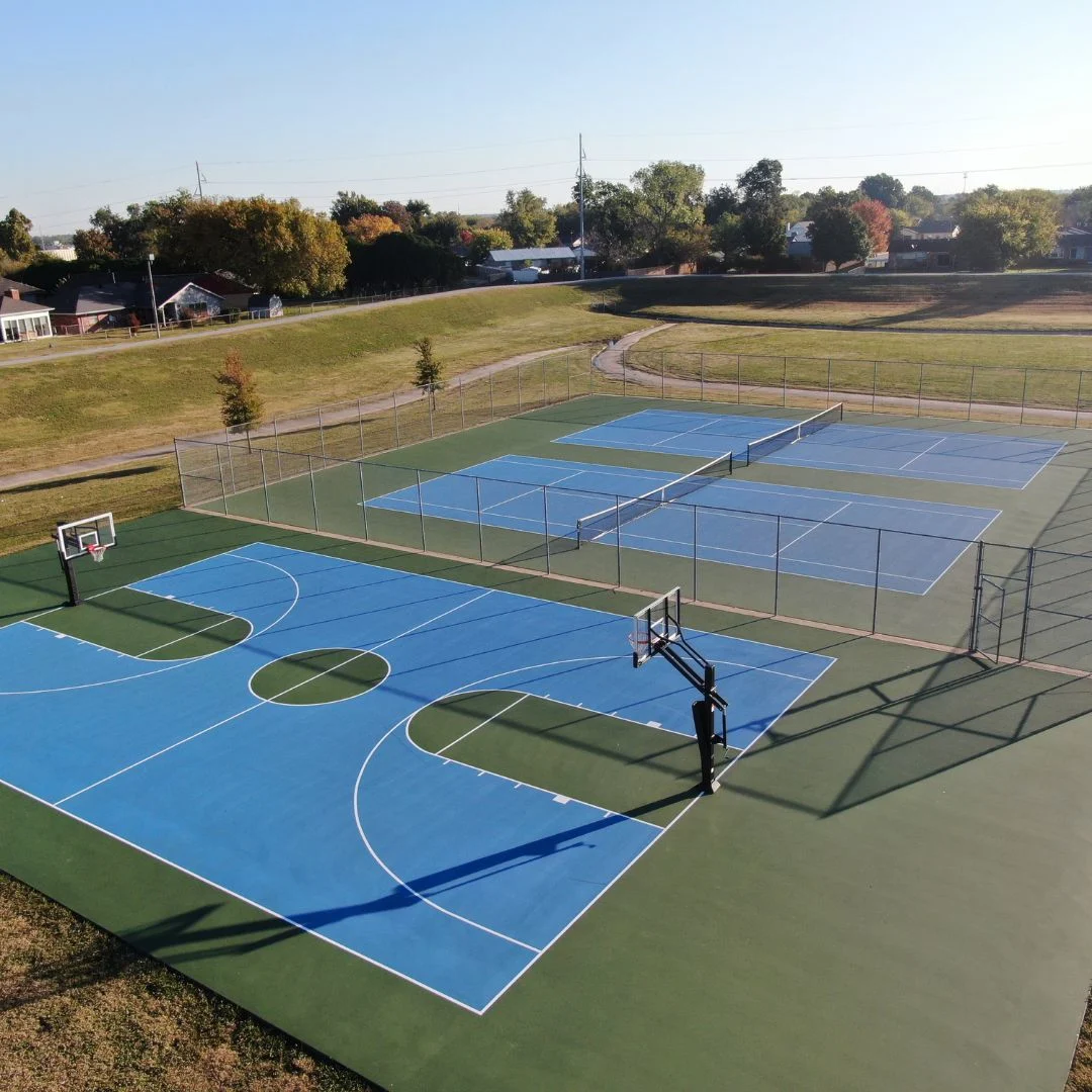 Aerial view of the resurfaced basketball and tennis courts at Aaronson Park in Tulsa, Oklahoma