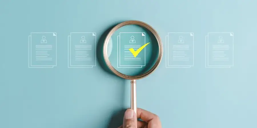 A magnifying glass held over a paper. Blogpost about identifying the right ideas to. invest in as a company.