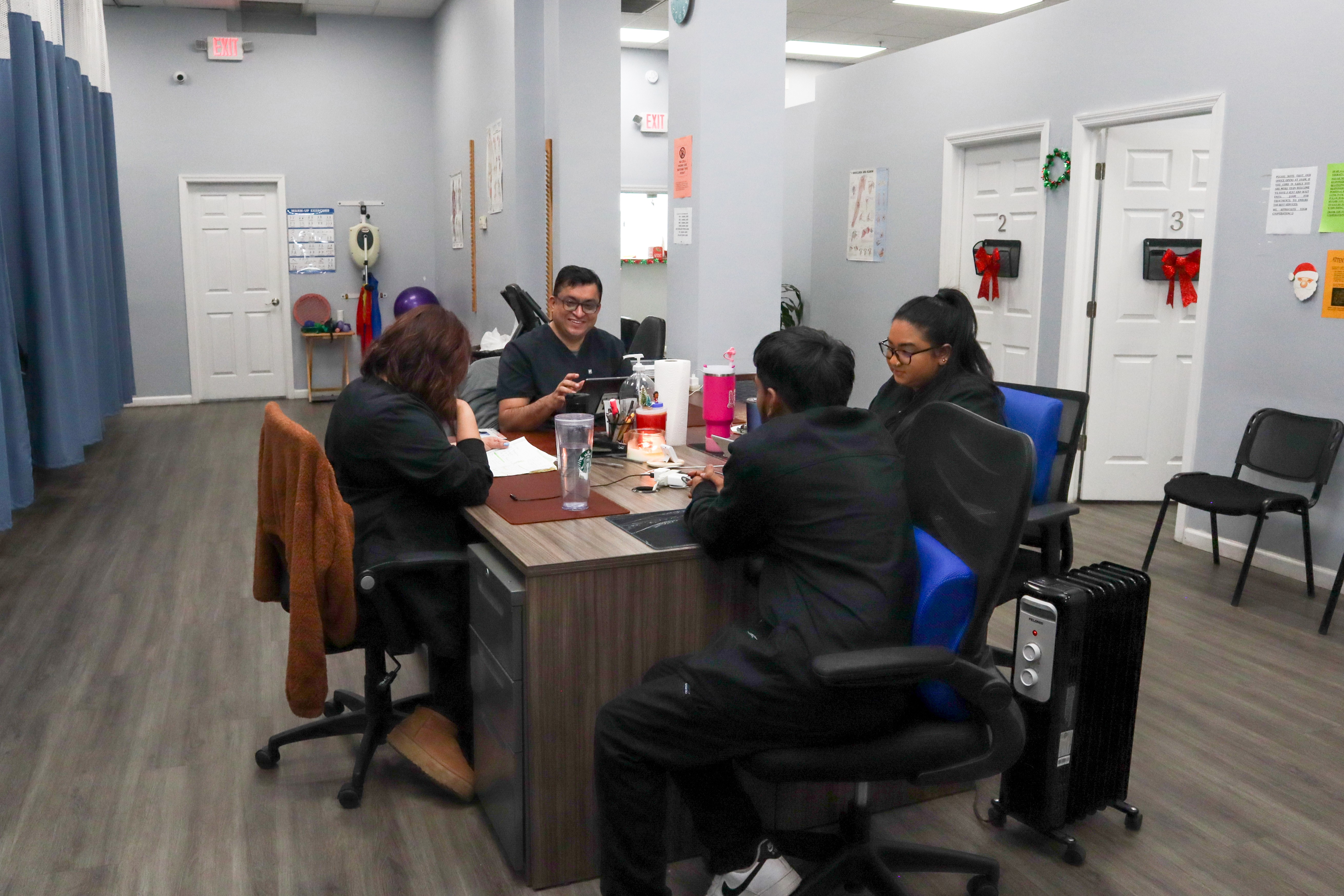 brunette-female-doctor-talking-patient-doctors