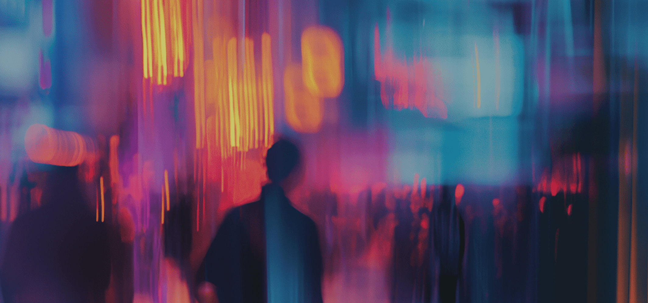 Blurred scene depicting individuals walking in a city, emphasizing the dynamic atmosphere of urban exploration.