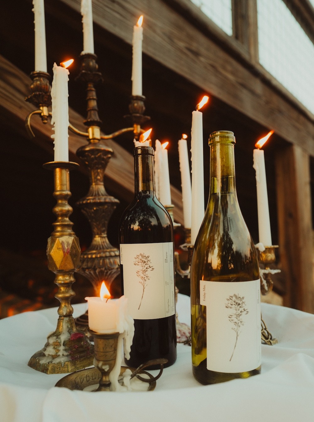 Wines on a table with candles