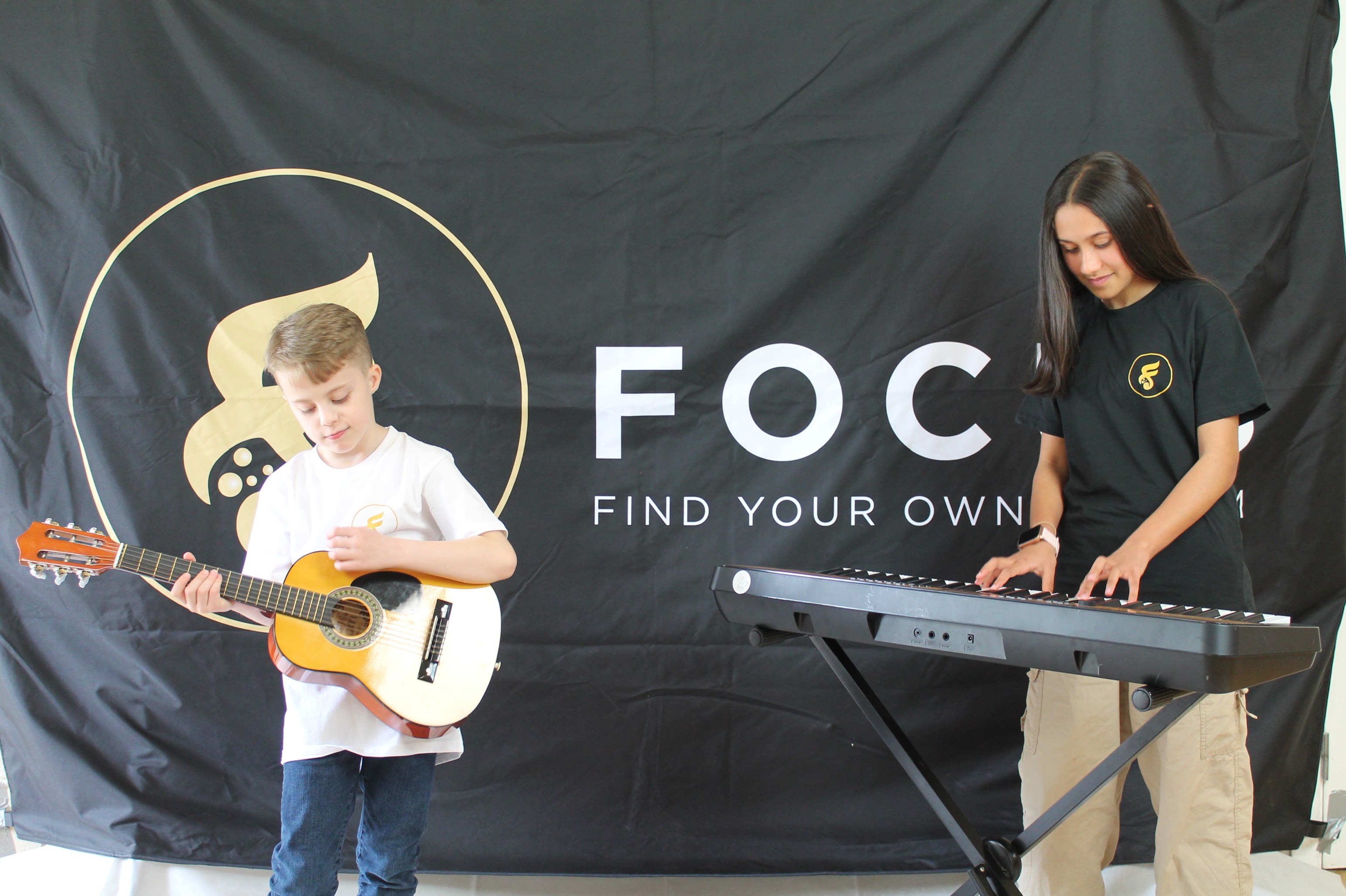 Students practising their skills with Guitar and Keyboard