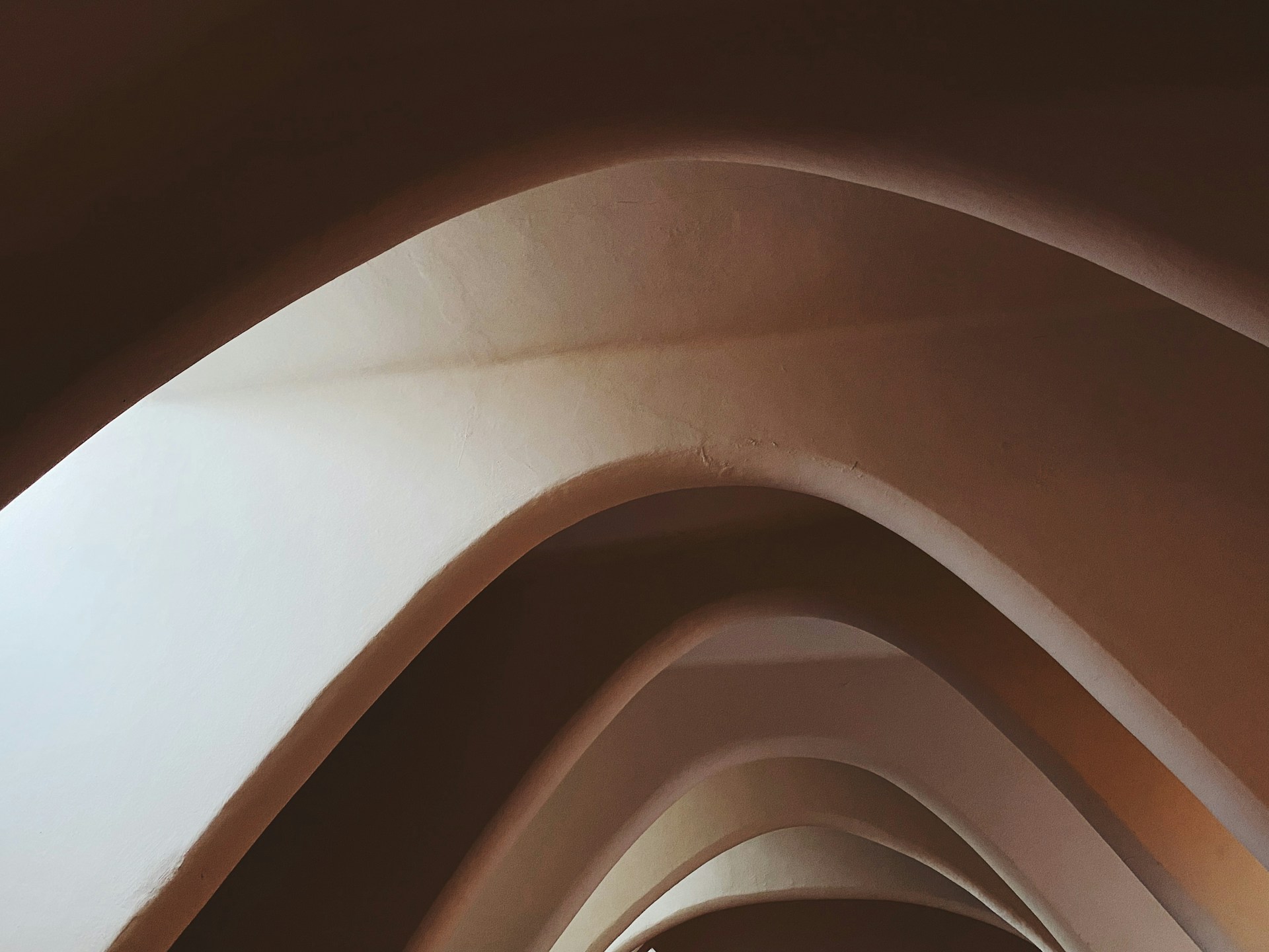 a very long hallway with a clock on the wall