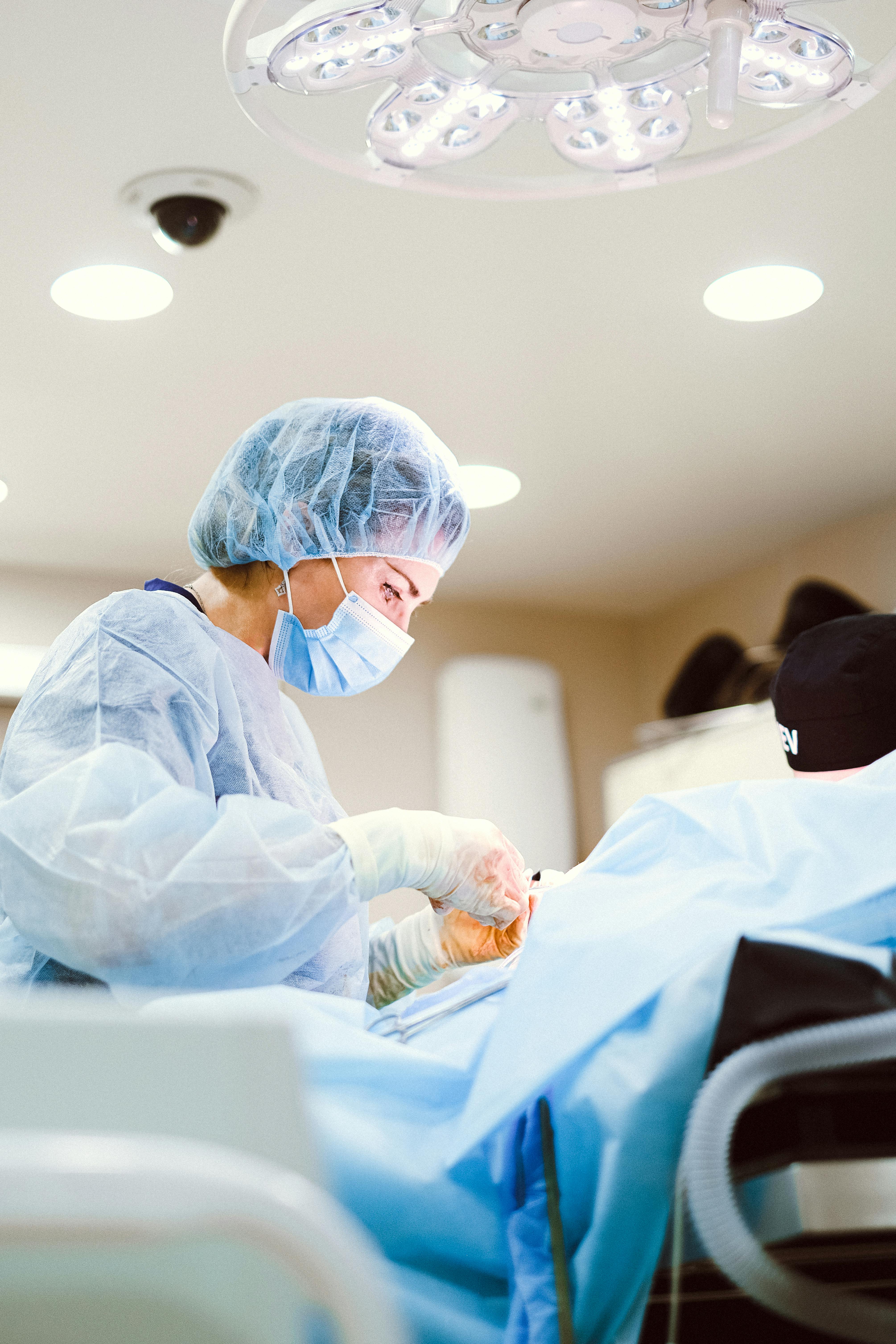 Surgeon in scrubs preparing for procedure