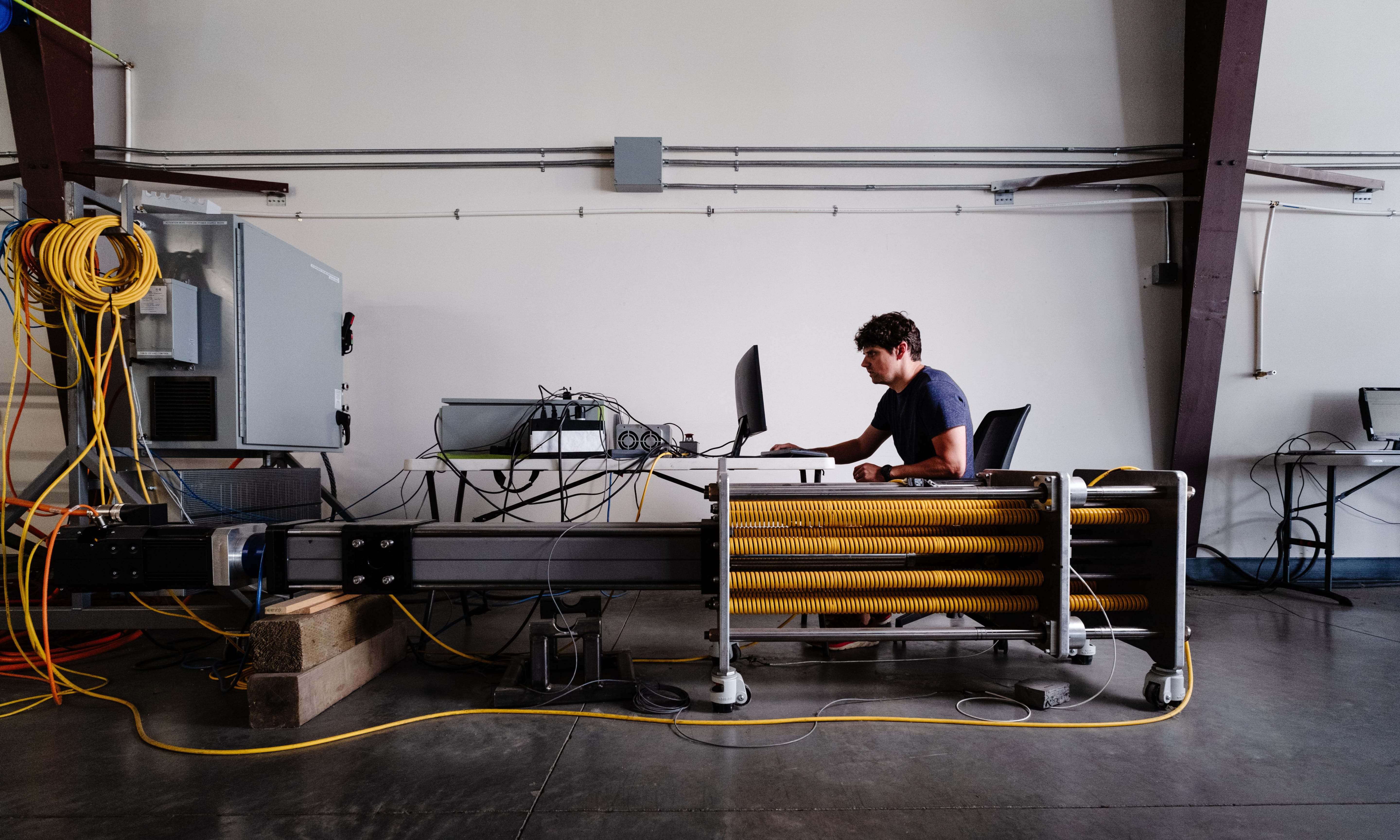 Man sitting at computer in warehouse