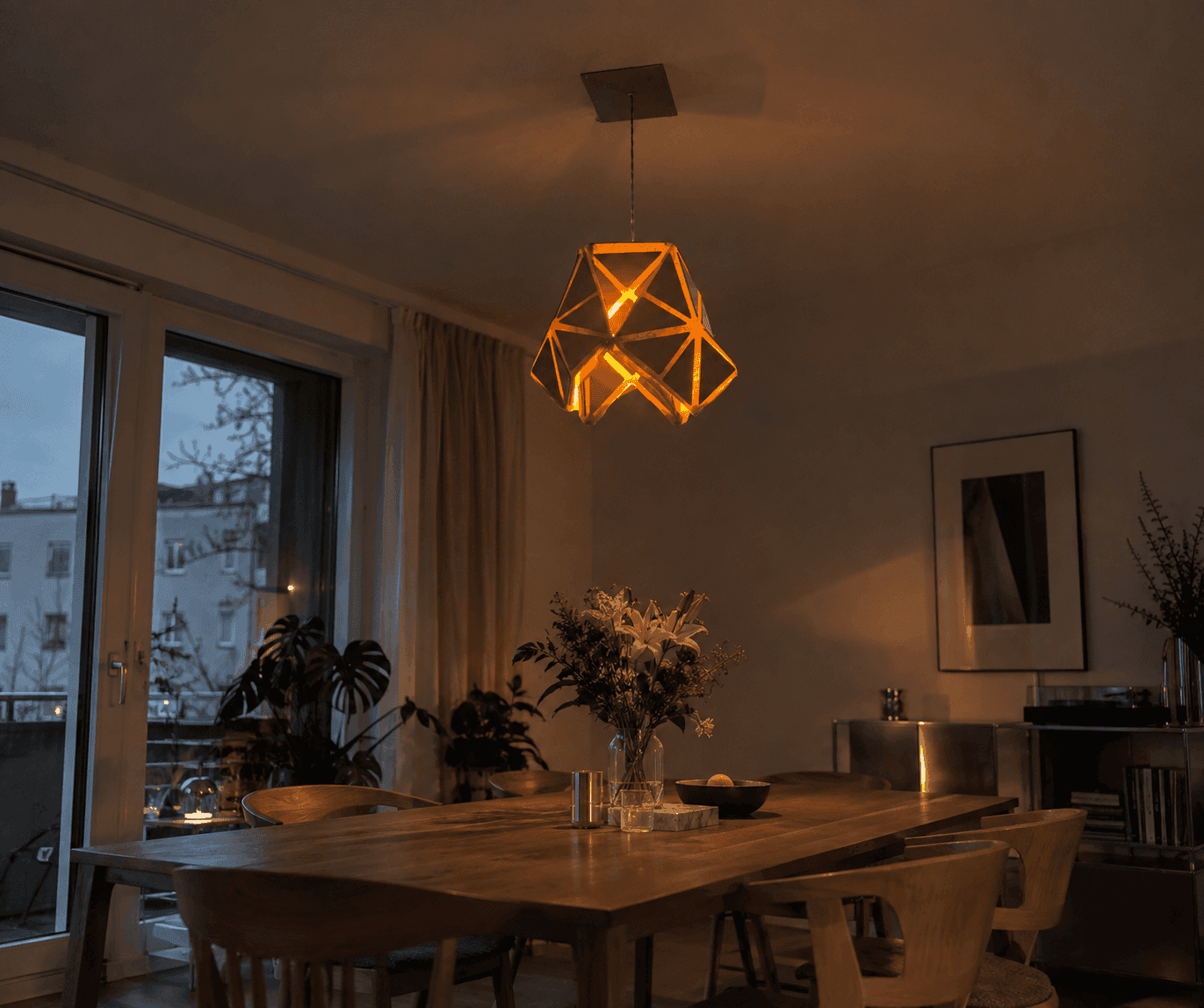Tridoom illuminated over a dining table