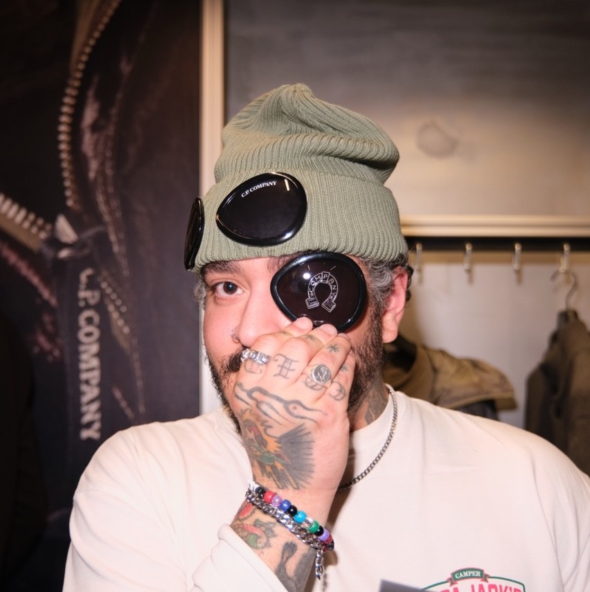 Woman wears a blue coat in a blue environment.