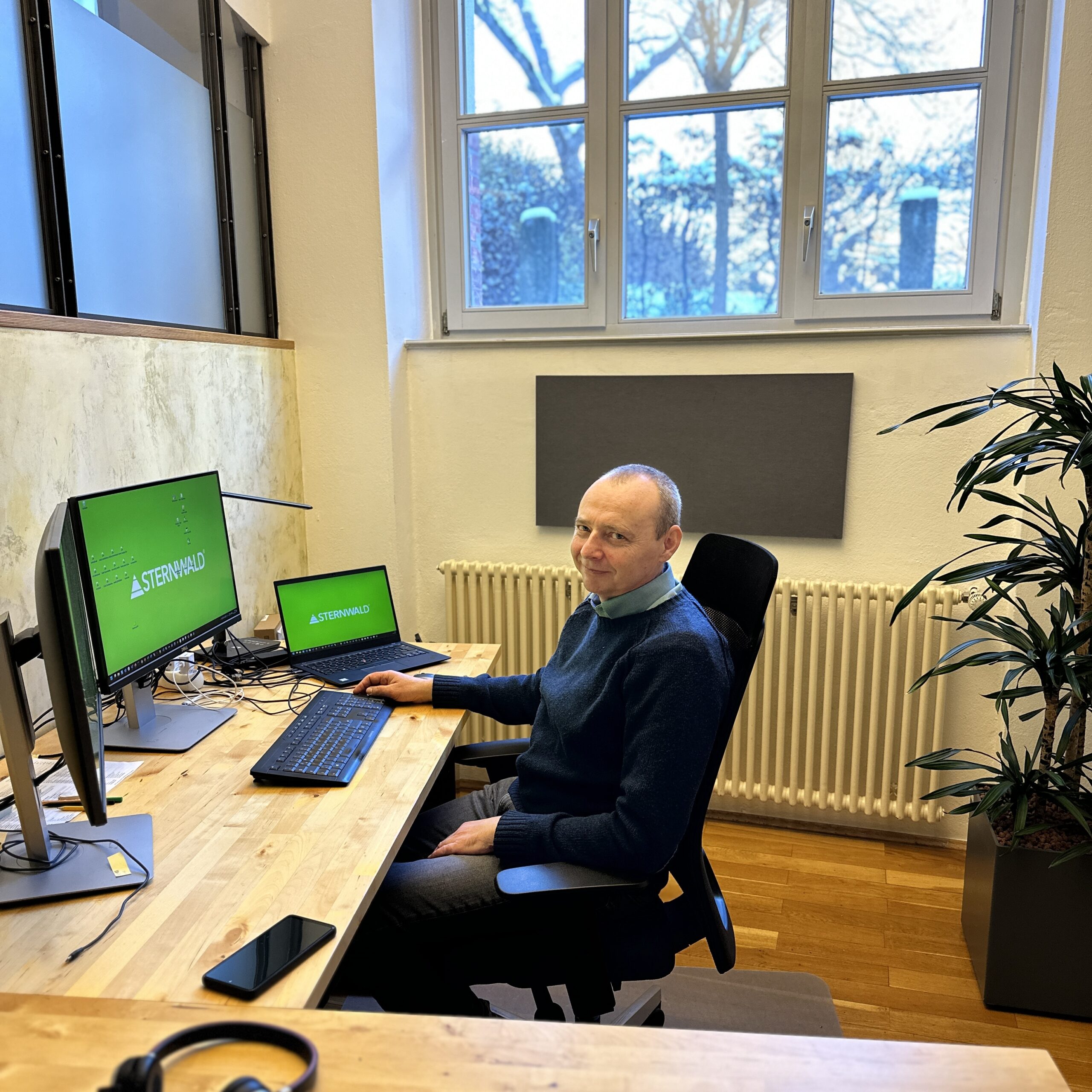 person sitting in a chair in front of a man