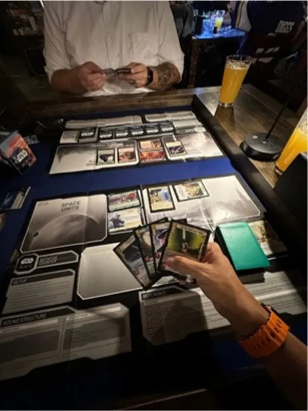 People playing Star Wars:Unlimited at a gaming bar.