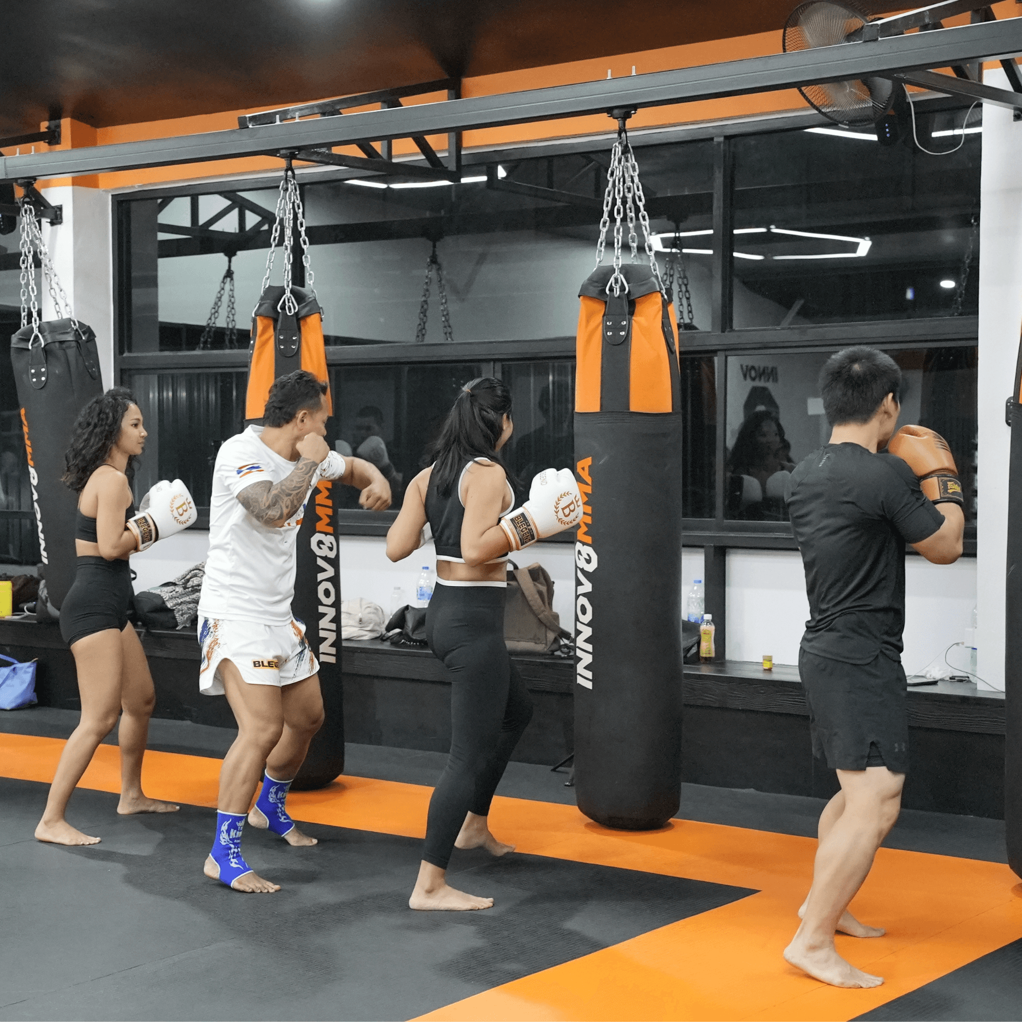 group class of muay thai fighters warming up