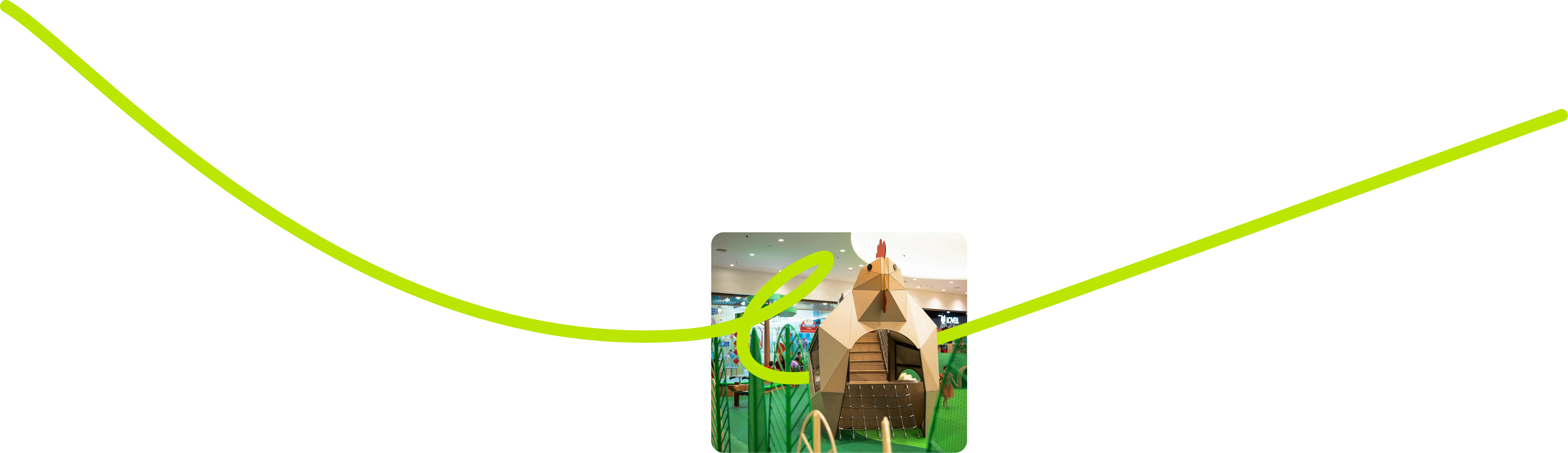 Colorful playground with green structures, a large clock, flowers, and city skyline in the background.