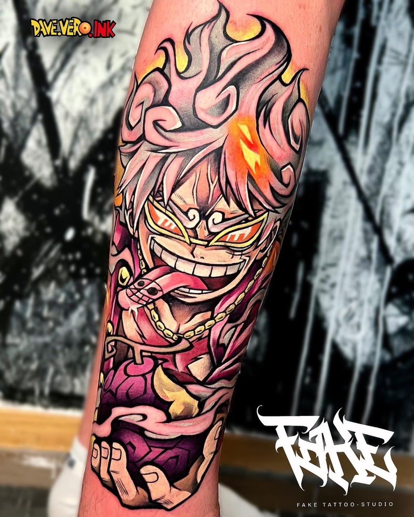 An intense tattoo of Gear 5 Luffy, tongue out and surrounded by fiery swirls, capturing his chaotic energy, designed by Dave Vero.