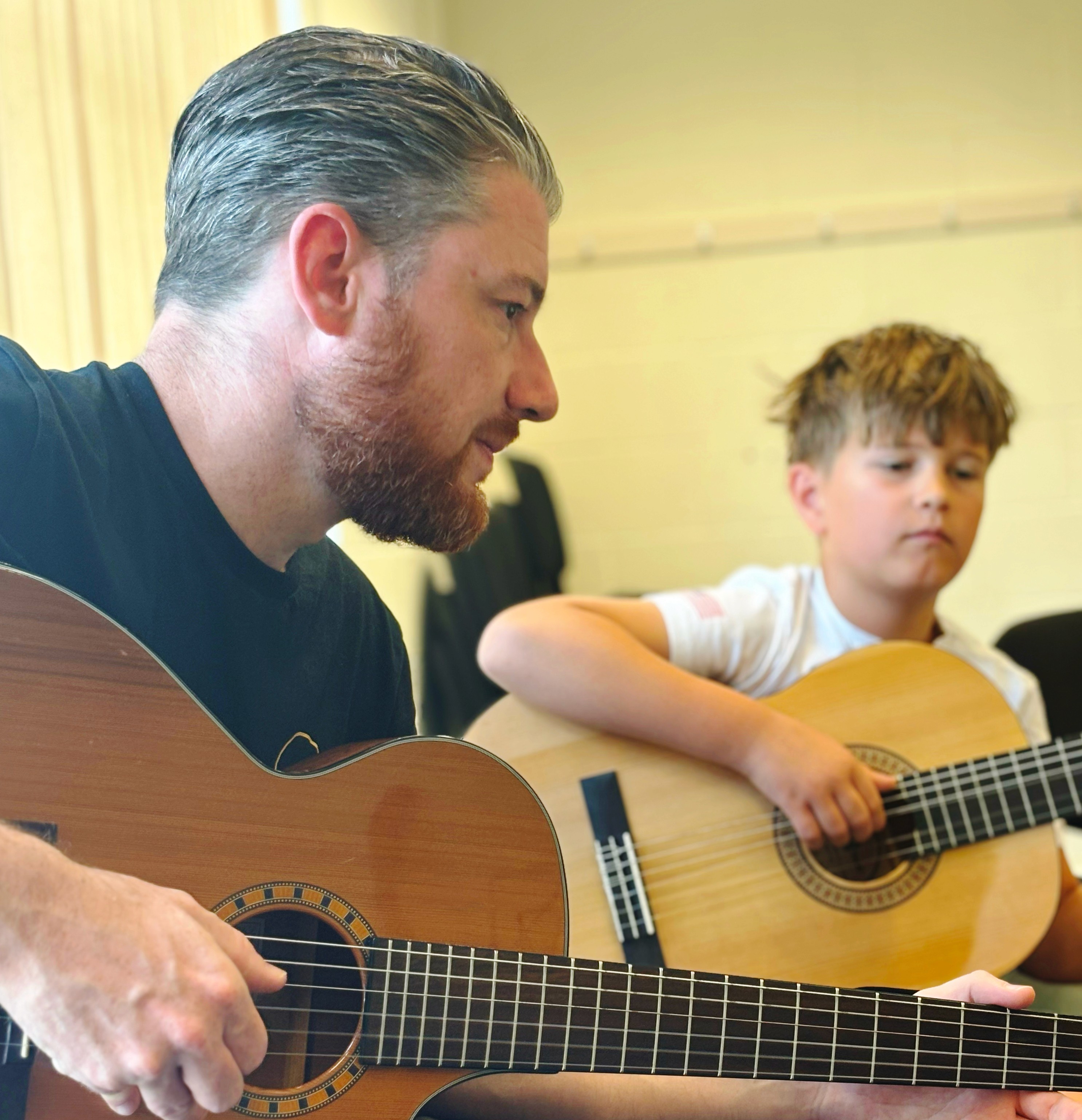 Students practising their skills with Guitar and Keyboard