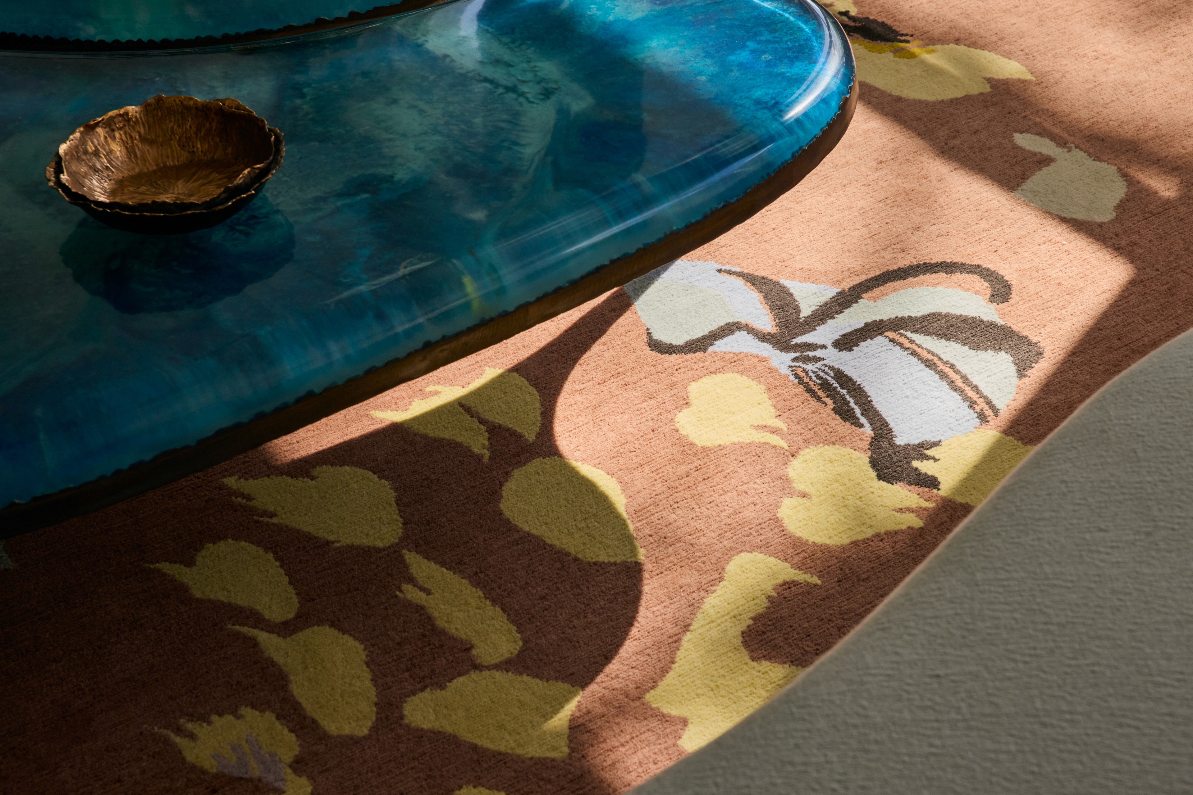 luxurious bespoke rug design and artistic coffee table vignette