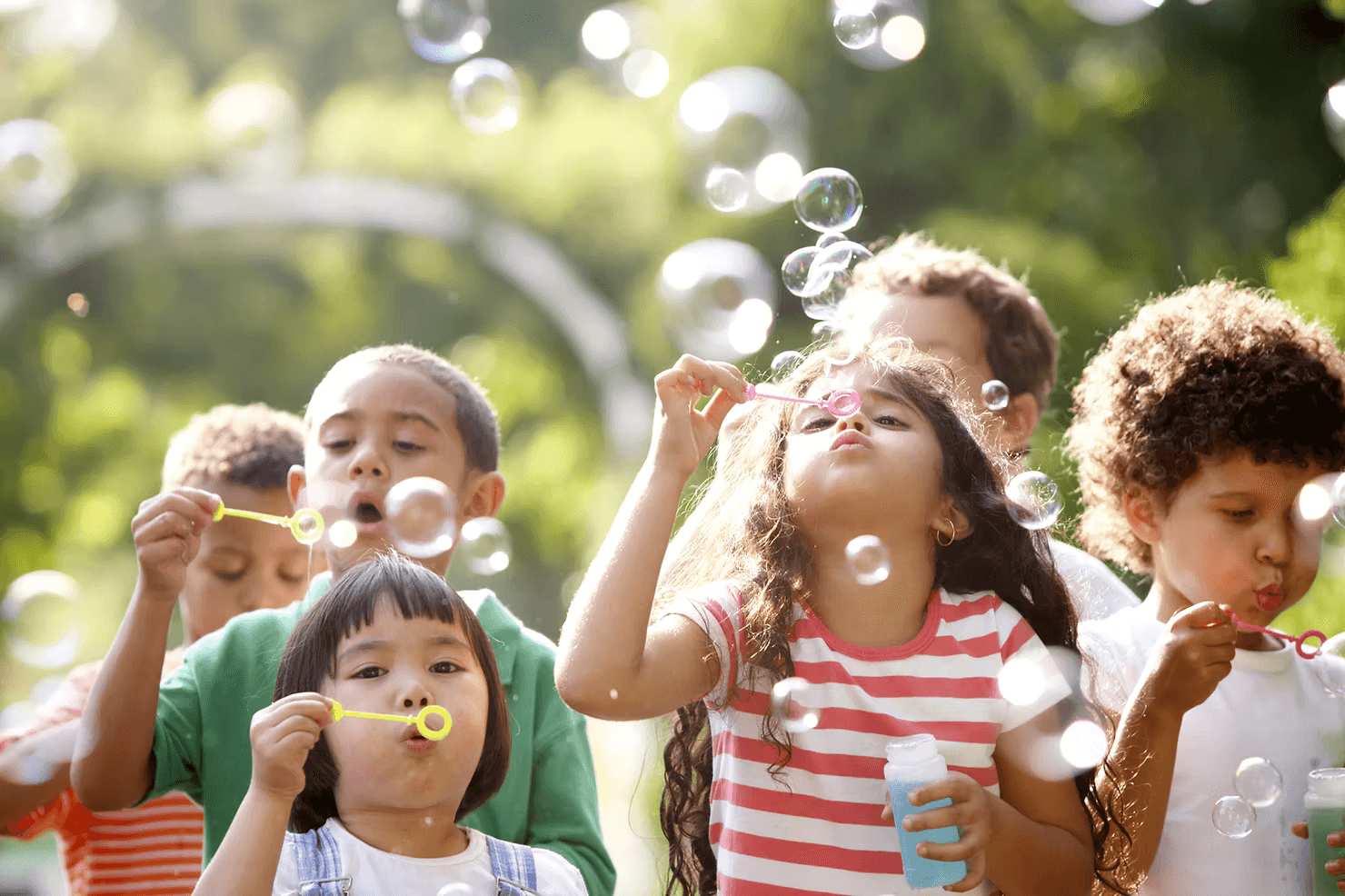 Children blowing bubbles