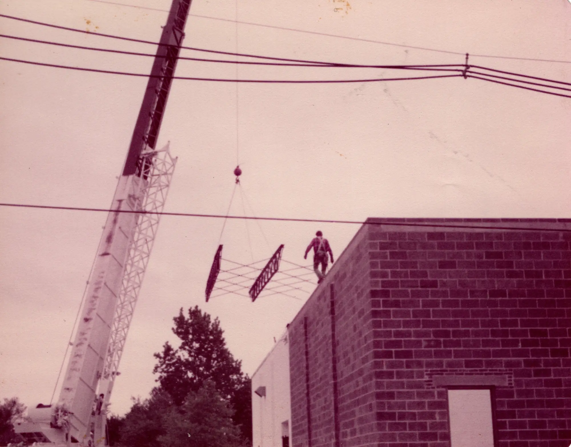 seven construction workers standing on white field