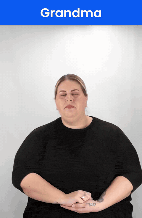 Animated GIF: a Deaf signer signs GRANDMA in ASL, an open hand moving from the chin forward in two small arcs.