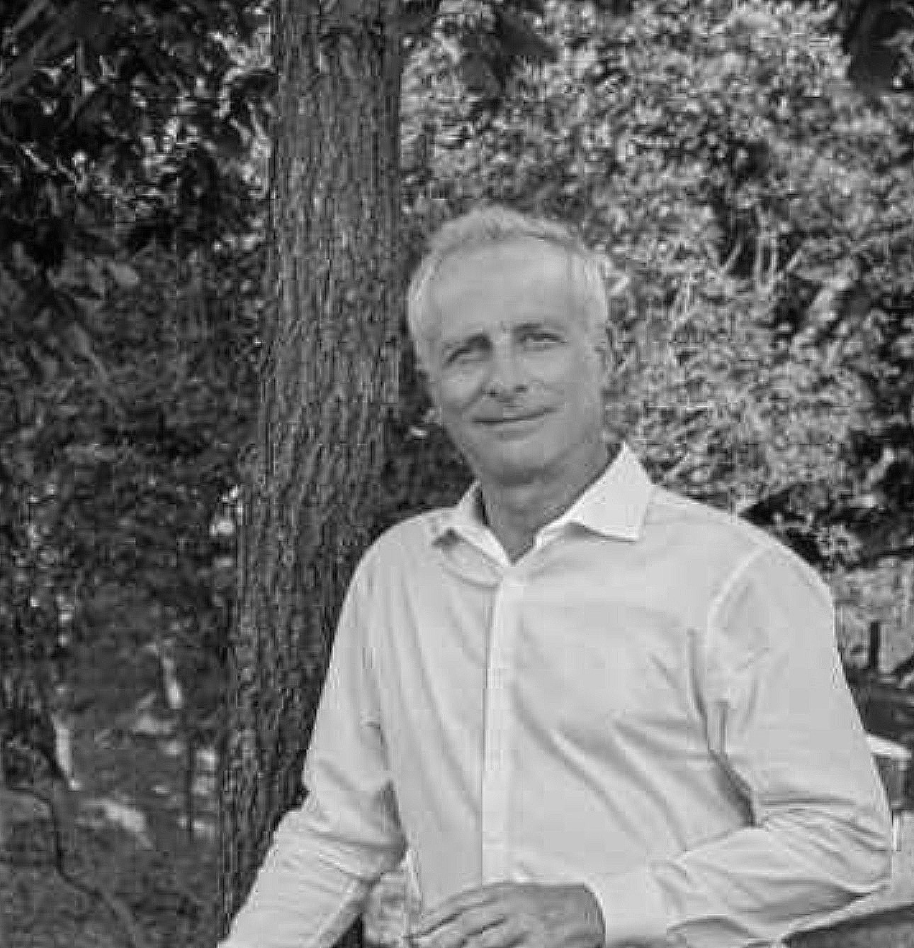 Professional man in black shirt smiling