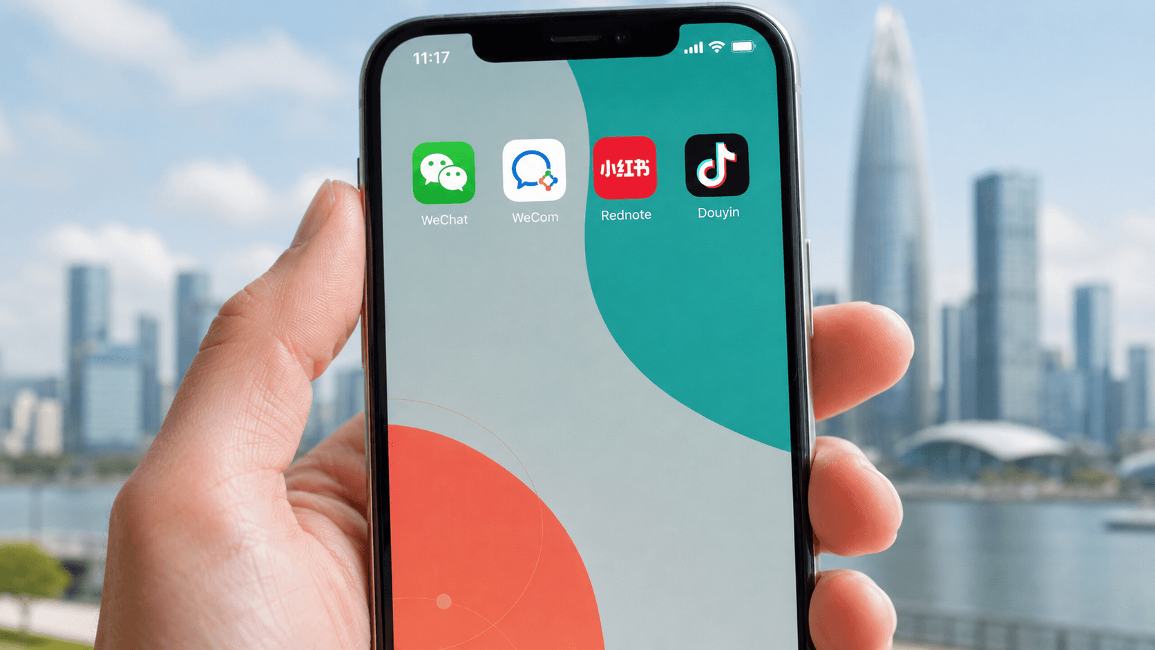 Hand holding a smartphone showing WeChat, WeCom, Rednote, and Douyin app icons against a modern Chinese city skyline.
