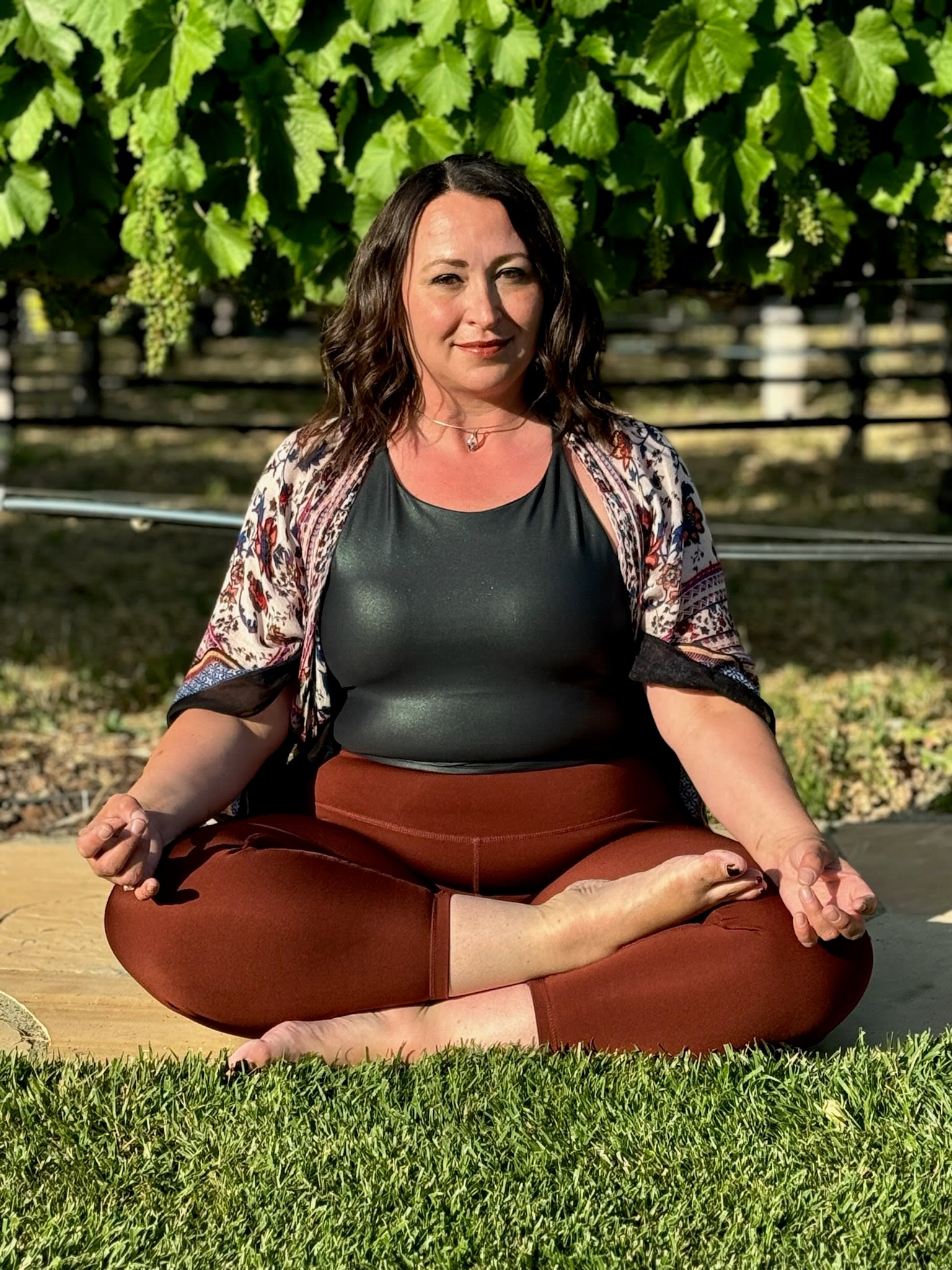 woman staring directly at camera near pink wall