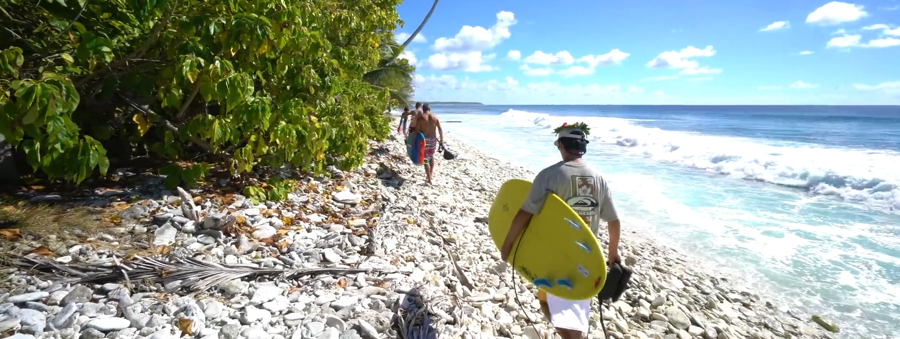 woman holding a phone and man looking at the phone. both are smiling