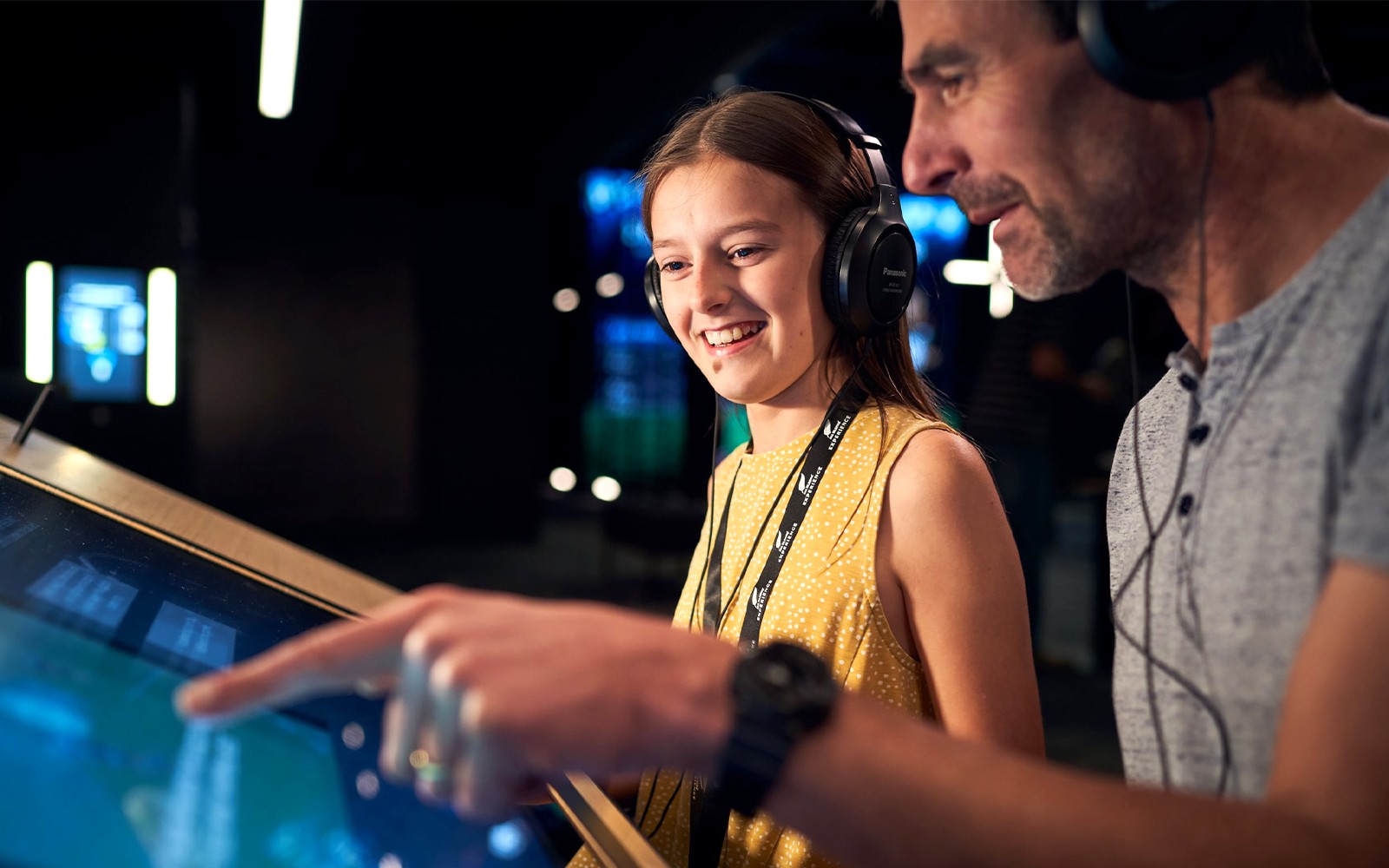 Visitors engaging with interactive display at All Blacks Experience, New Zealand.