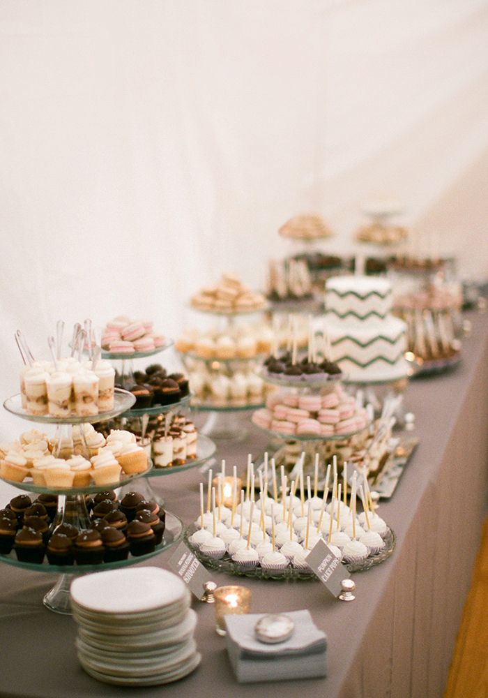 Cake pops, macarons, cupcakes on a display