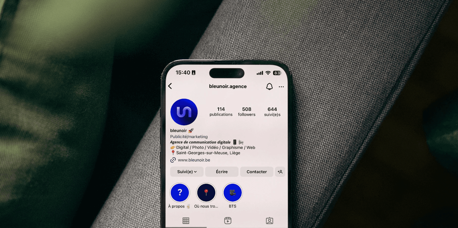 Three slim, upright orange packaging boxes side by side, each showing a partial black smiley face and “Smiley Co” text on the top, with a matching orange background.